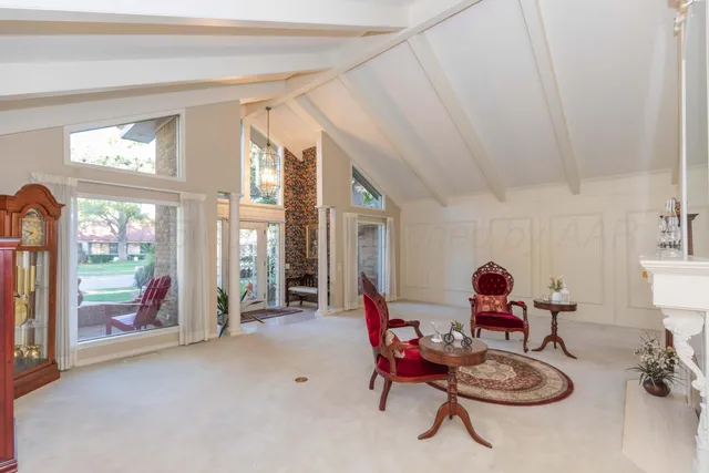 a dining room with furniture and window