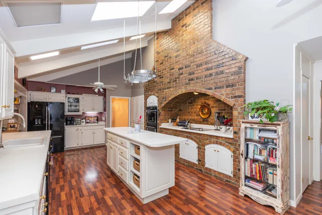 a living room with furniture fireplace and a flat screen tv