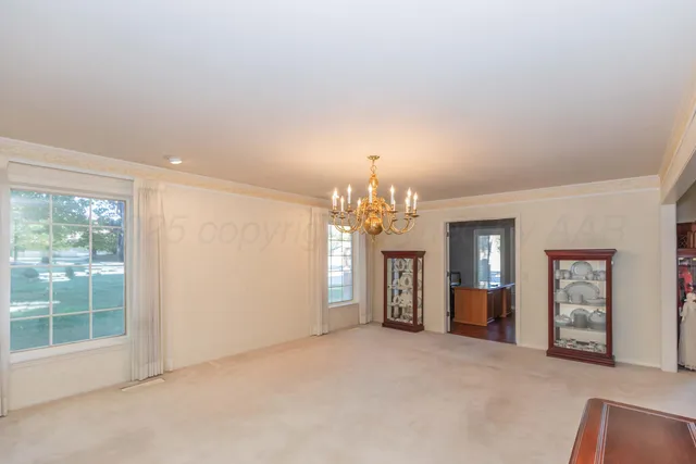 a bedroom with a bed furniture and a window