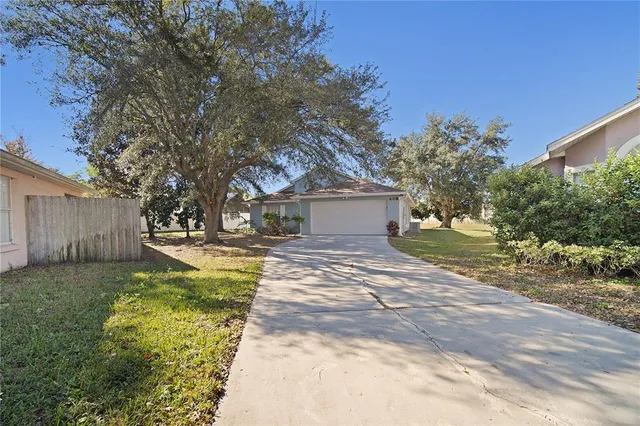 a front view of a house with a yard garage and outdoor seating