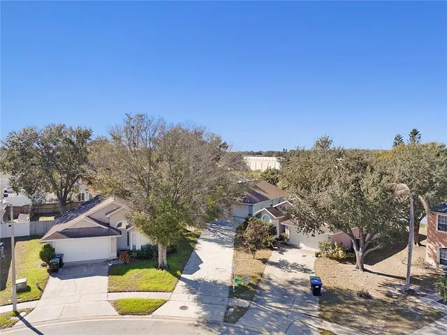 a view of a swimming pool with a yard