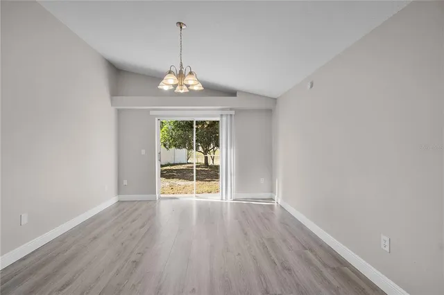 a view of livingroom with window hardwood floor and front door