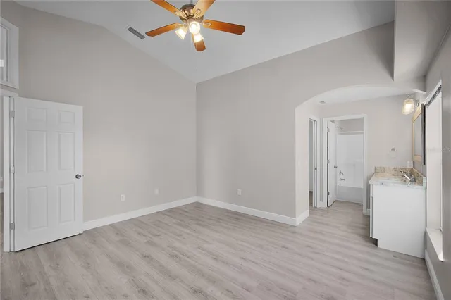 a view of an empty room and wooden floor
