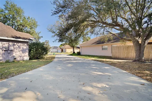 a view of a house with a yard and garage