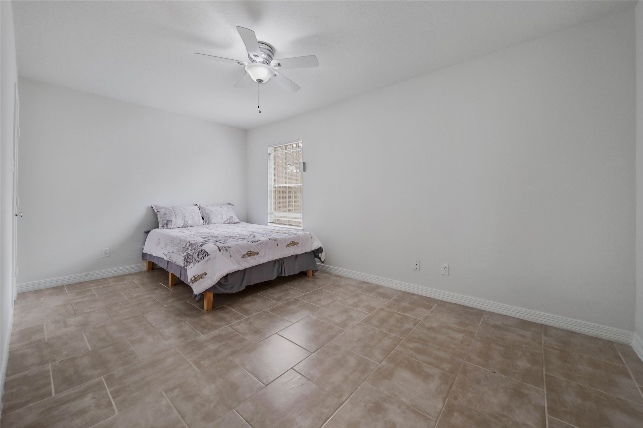 4943 Gammage Street Houston, TX 77021 - Photo 21 of 22 Both guest bedrooms are spacious (10x16) and have ceiling fans, blinds and walk in closets. Bed frame provided- just bring your favorite mattress and bedding.