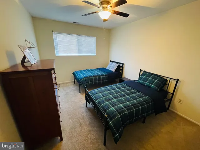 a bedroom with bed and window