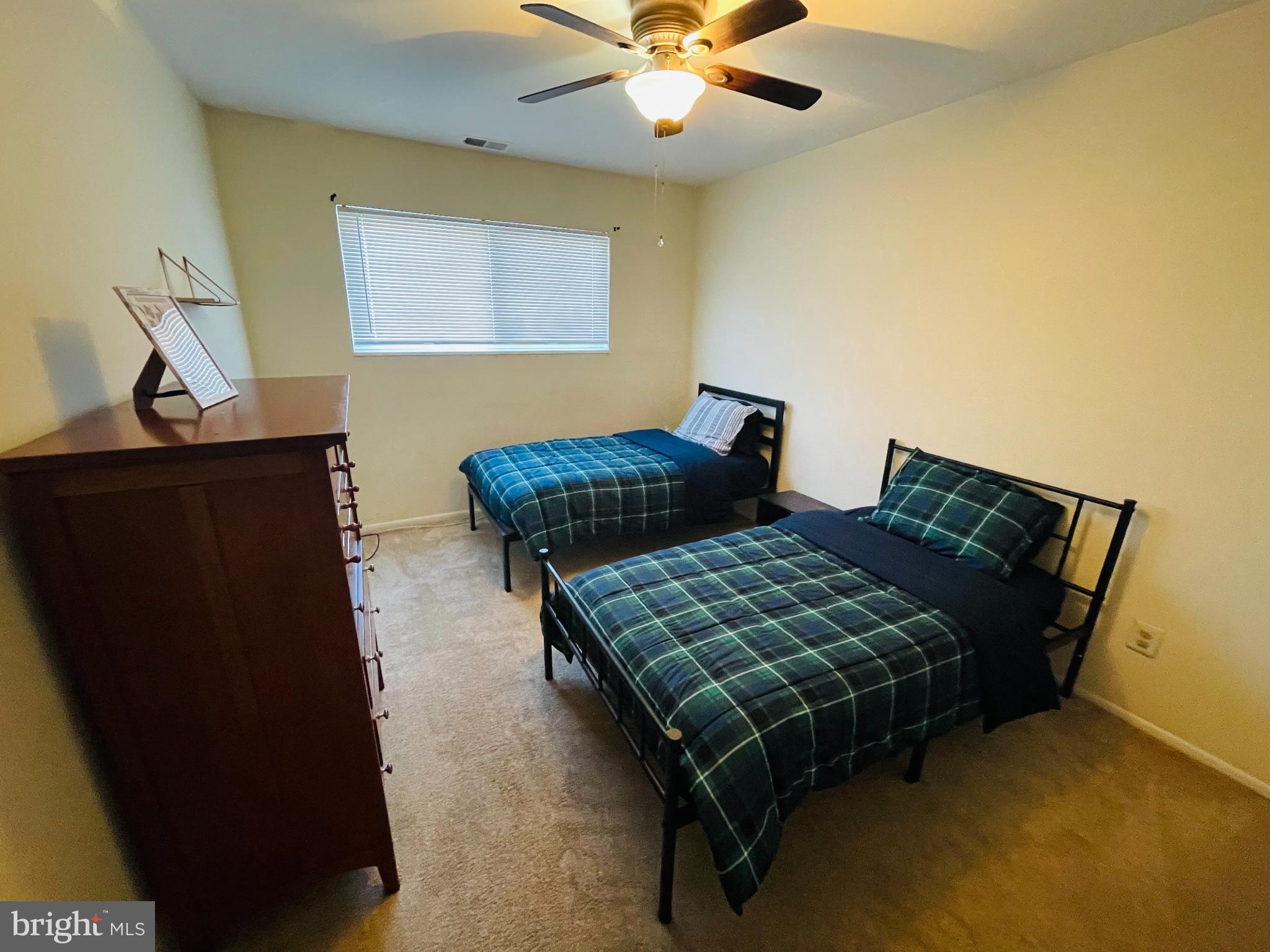 46 Township Line Road, Unit 215 Elkins Park, PA 19027 - Photo 8 of 17 a bedroom with bed and window