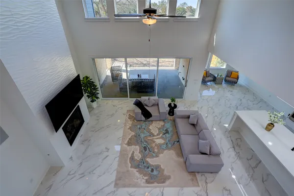 a view of entryway with a white walls and a clock on it