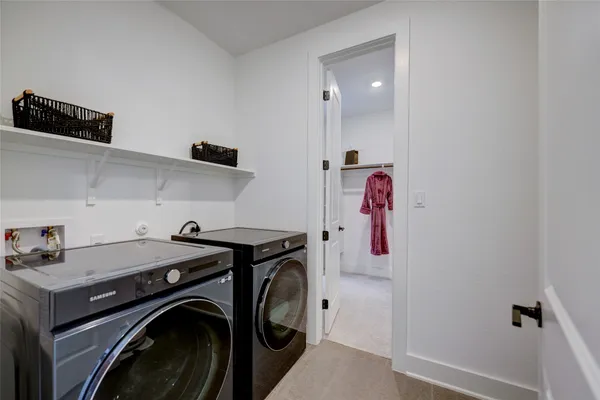a bedroom with a bed and cabinets