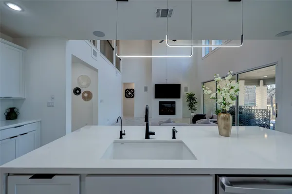 a view of kitchen with sink and natural light