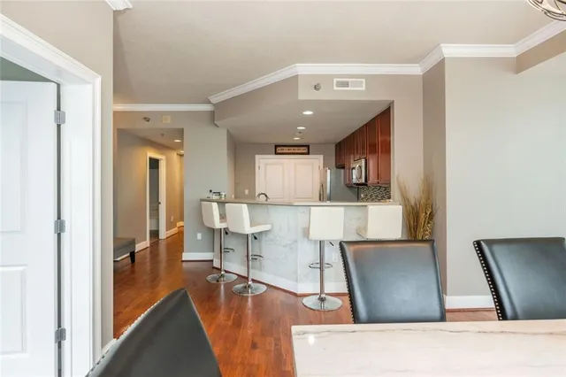 a view of living room with furniture and a flat screen tv
