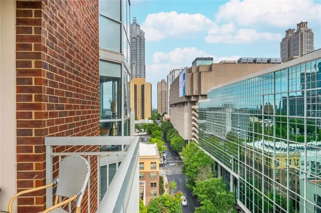 a view of a balcony with iron fence