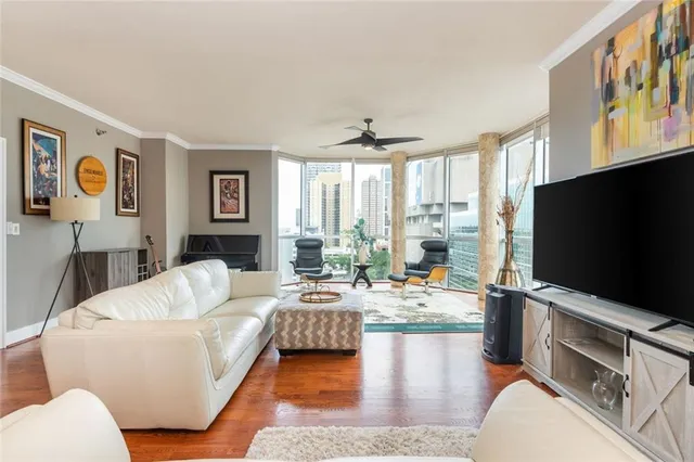 a living room with fireplace furniture and a flat screen tv