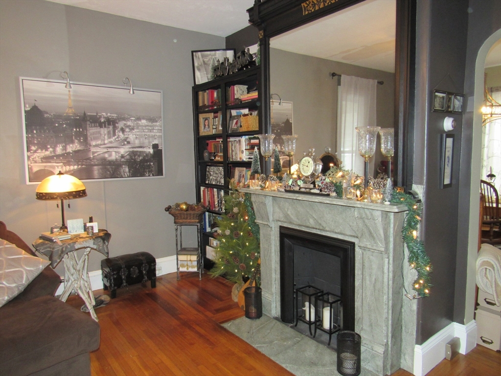 96 Main Street, Unit 1 Blackstone, MA 01504 - Photo 11 of 16 a living room with furniture and a fireplace