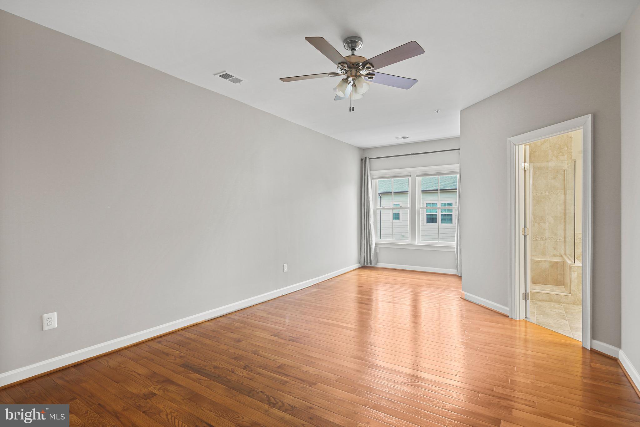 3553 Katherine Way Frederick, MD 21704 - Photo 12 of 34 a view of an empty room and wooden floor