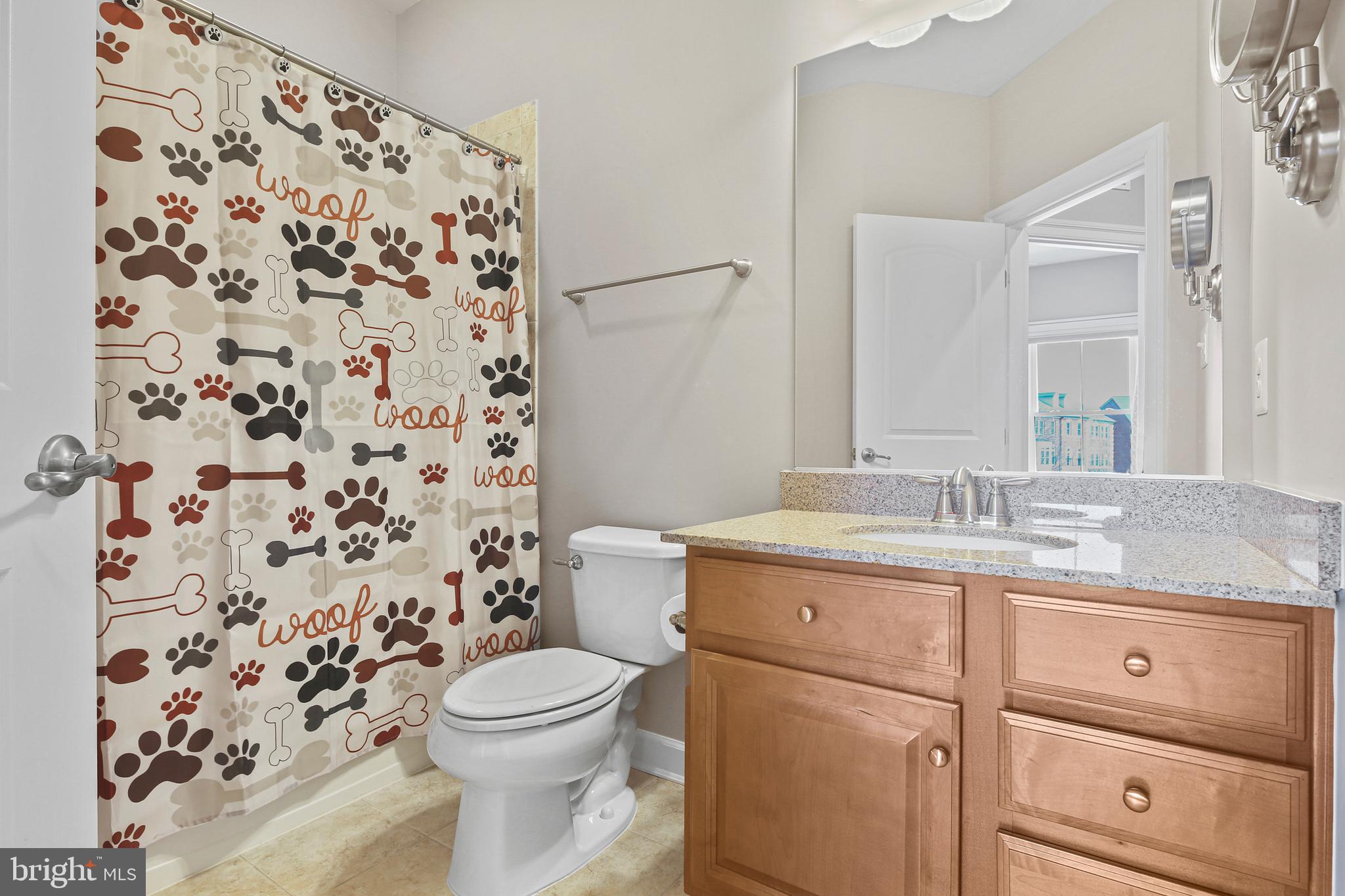 3553 Katherine Way Frederick, MD 21704 - Photo 16 of 34 a bathroom with a granite countertop toilet a sink and a mirror