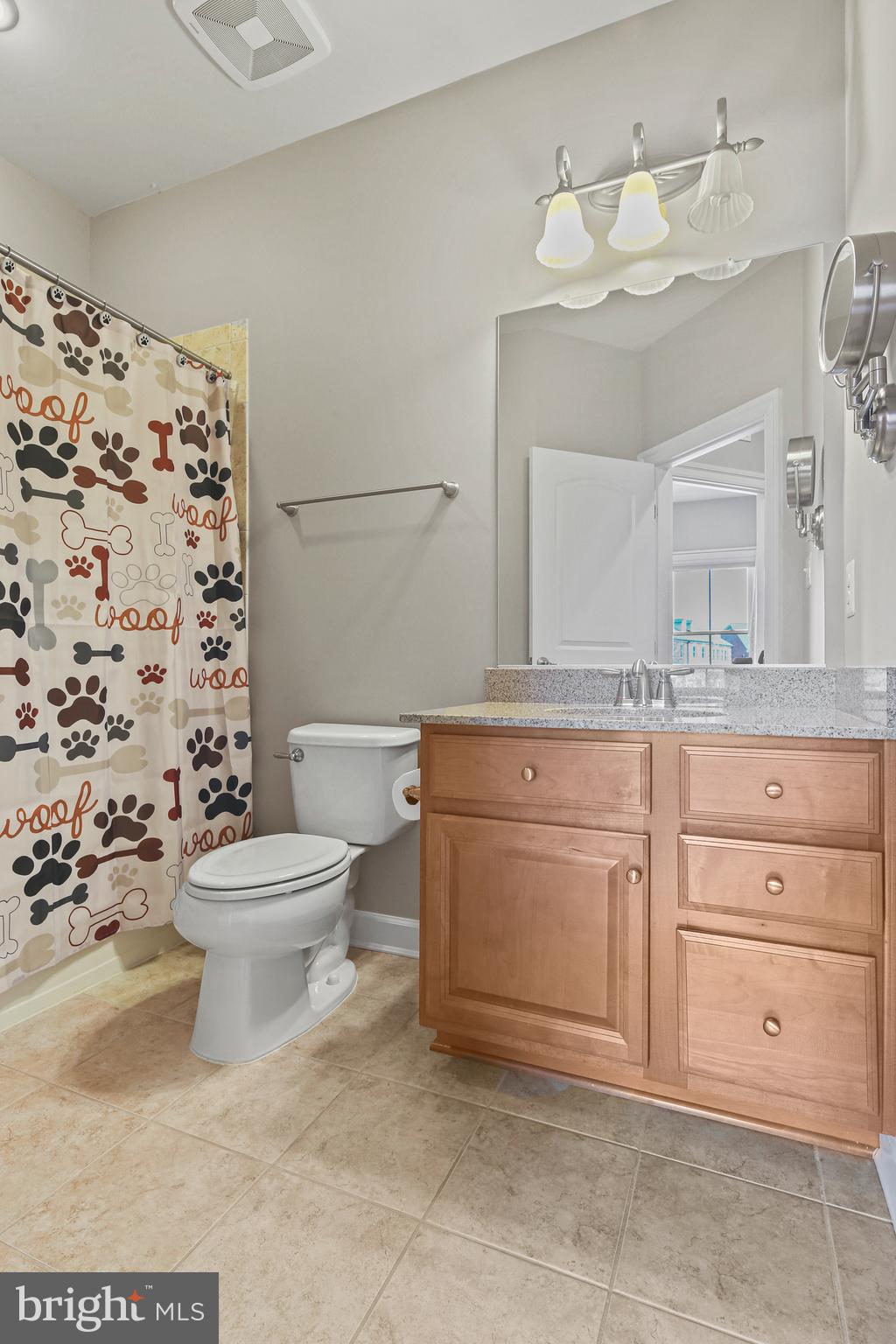 3553 Katherine Way Frederick, MD 21704 - Photo 17 of 34 a bathroom with a granite countertop toilet sink and mirror