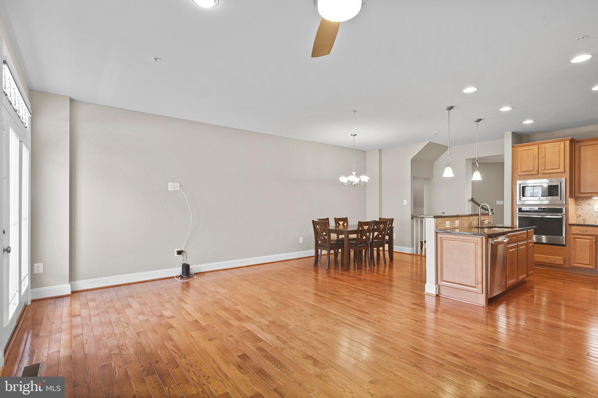 3553 Katherine Way Frederick, MD 21704 - Photo 26 of 34 an open kitchen with dining table and chairs