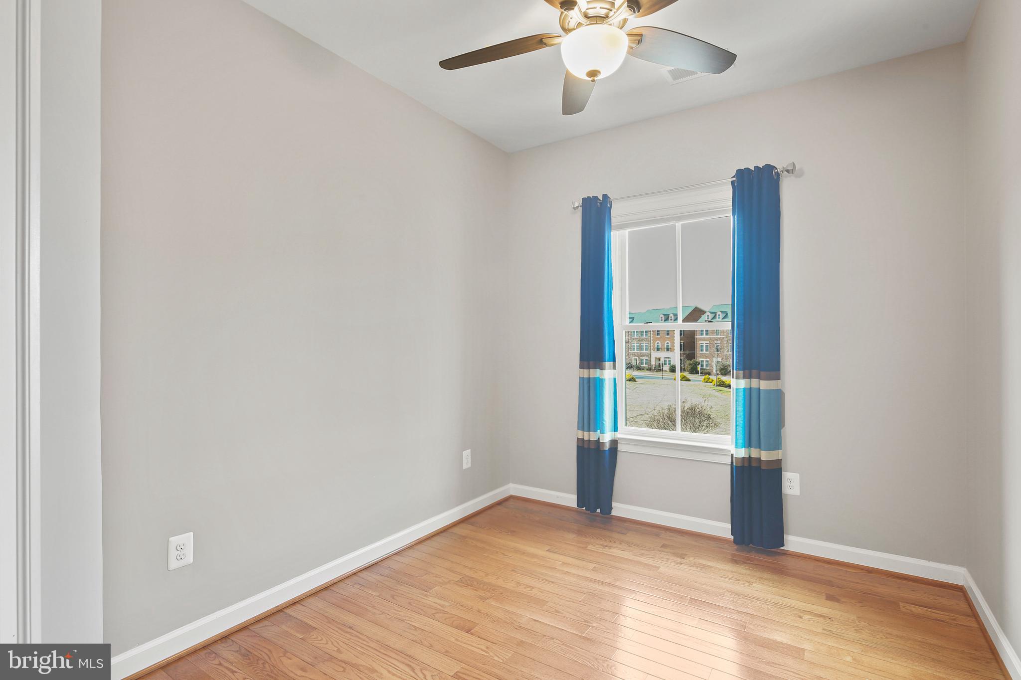 3553 Katherine Way Frederick, MD 21704 - Photo 10 of 34 an empty room with windows and ceiling fan