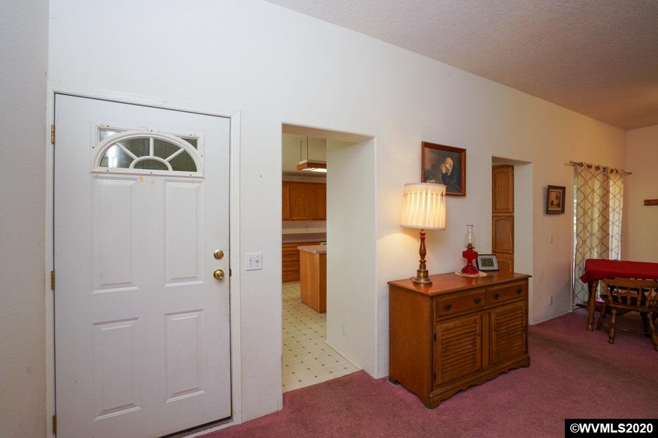 17265 Butler Hill Road Dallas, OR 97338 - Photo 14 of 38 a view of a workspace with furniture and a dresser