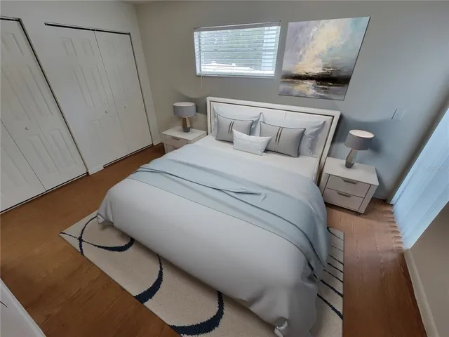 a bedroom with a bed and a dresser