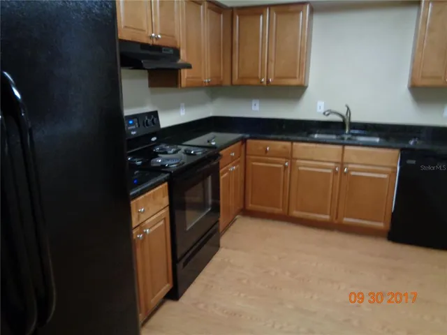 a bathroom with a sink toilet and a mirror