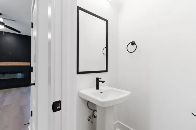 a bathroom with a sink and a mirror