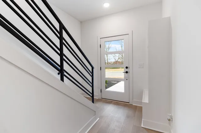 an entryway in a hall with a window