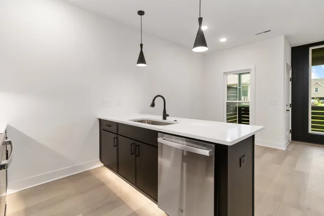 a kitchen with a sink and cabinets