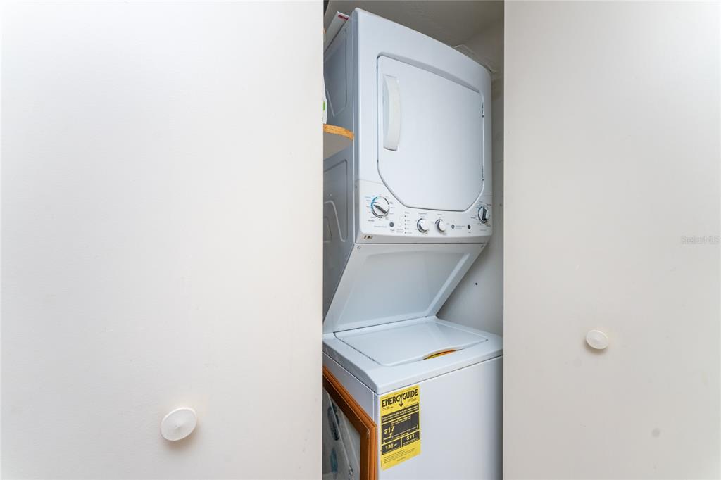 2955 North Beach Road, Unit B614 Englewood, FL 34223 - Photo 34 of 67 a utility room with dryer and washer