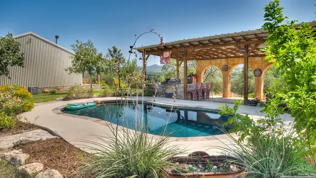 a living room with furniture a window and a clock