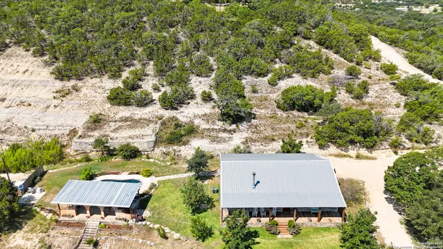 an aerial view of house with yard swimming pool and outdoor seating