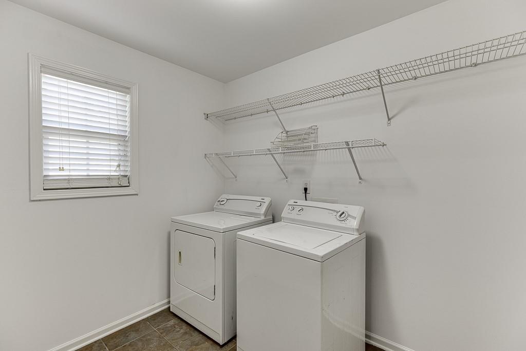 926 Red Wolf Court Dacula, GA 30019 - Photo 21 of 47 a utility room with dryer and washer