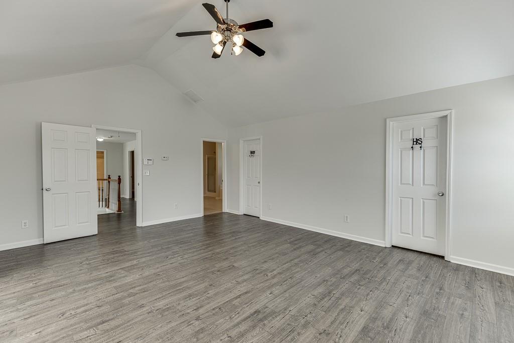 926 Red Wolf Court Dacula, GA 30019 - Photo 24 of 47 a view of empty room with wooden floor