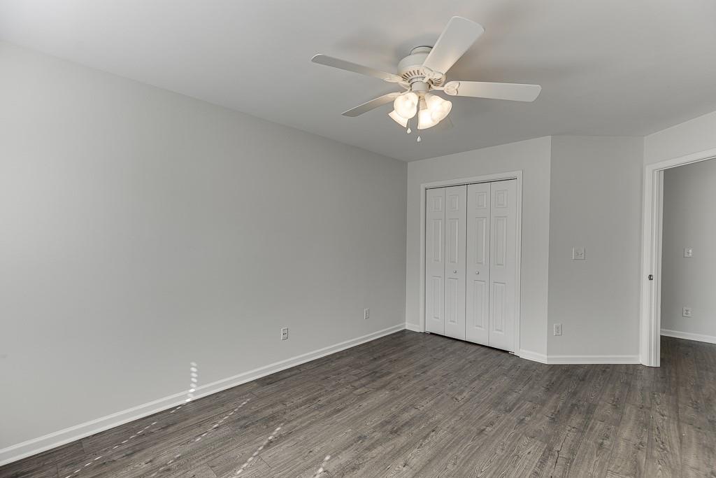 926 Red Wolf Court Dacula, GA 30019 - Photo 29 of 47 a view of an empty room with wooden floor