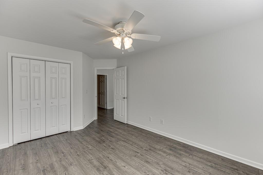 926 Red Wolf Court Dacula, GA 30019 - Photo 30 of 47 a view of an empty room with wooden floor