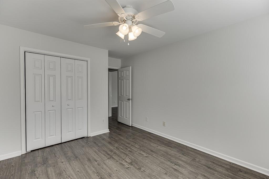 926 Red Wolf Court Dacula, GA 30019 - Photo 35 of 47 a view of an empty room with a fan
