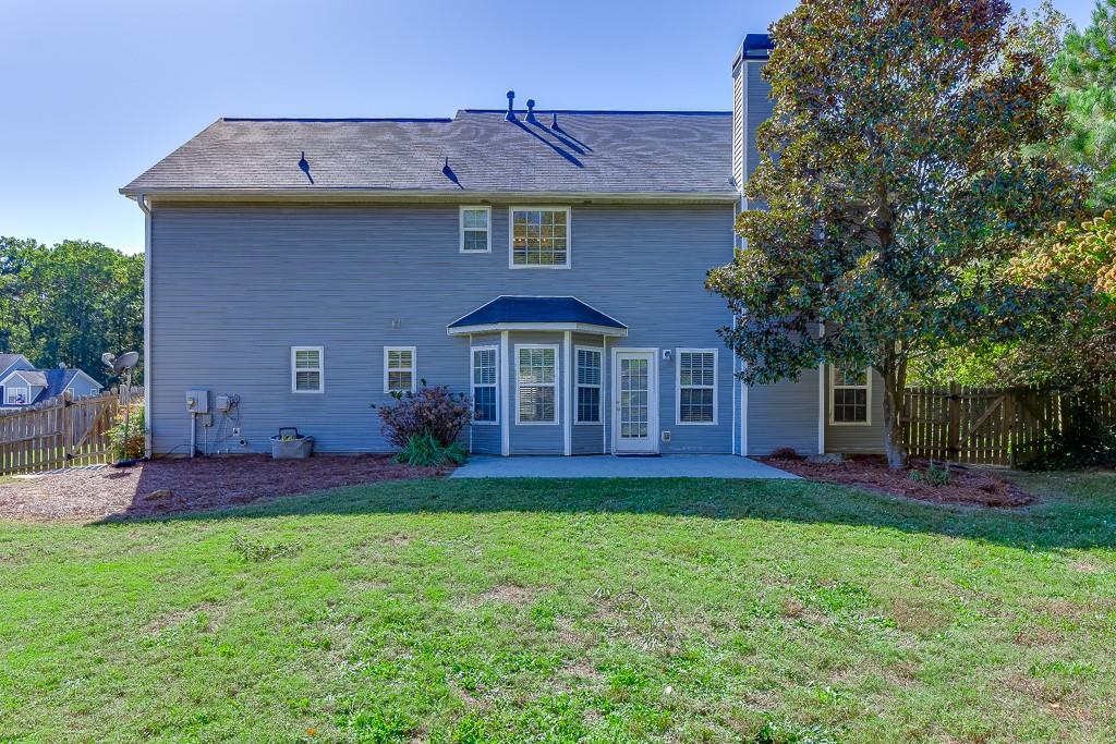926 Red Wolf Court Dacula, GA 30019 - Photo 38 of 47 a view of a yard in front of a house with large trees