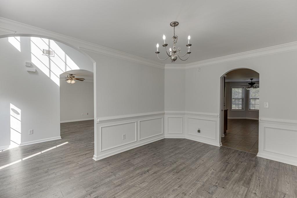 926 Red Wolf Court Dacula, GA 30019 - Photo 7 of 47 wooden floor in an empty room with a window