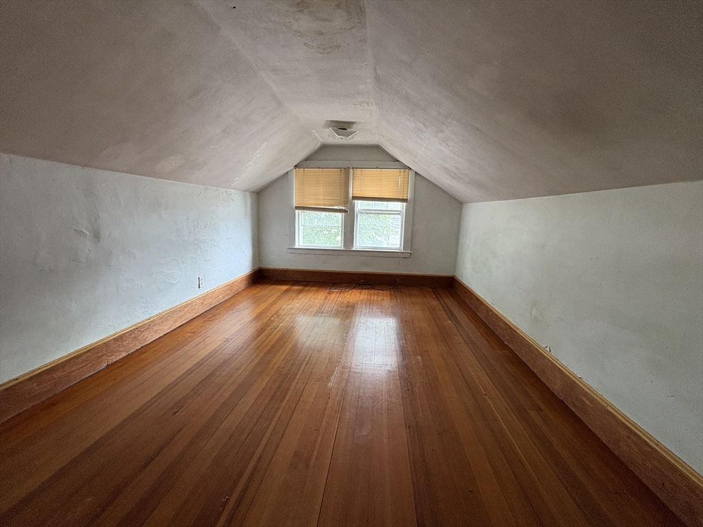 28 Woodward Street, Unit 2 Newton, MA 02461 - Photo 18 of 20 an empty room with wooden floor and windows