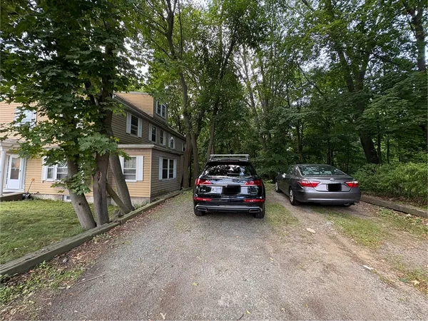 a car parked in front of a house