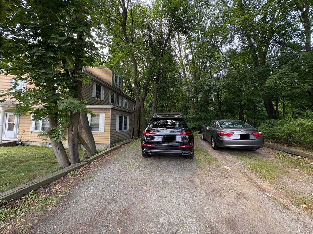 28 Woodward Street, Unit 2 Newton, MA 02461 - Photo 20 of 20 a car parked in front of a house