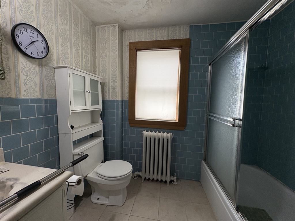 28 Woodward Street, Unit 2 Newton, MA 02461 - Photo 10 of 20 a bathroom with a toilet a sink and a shower