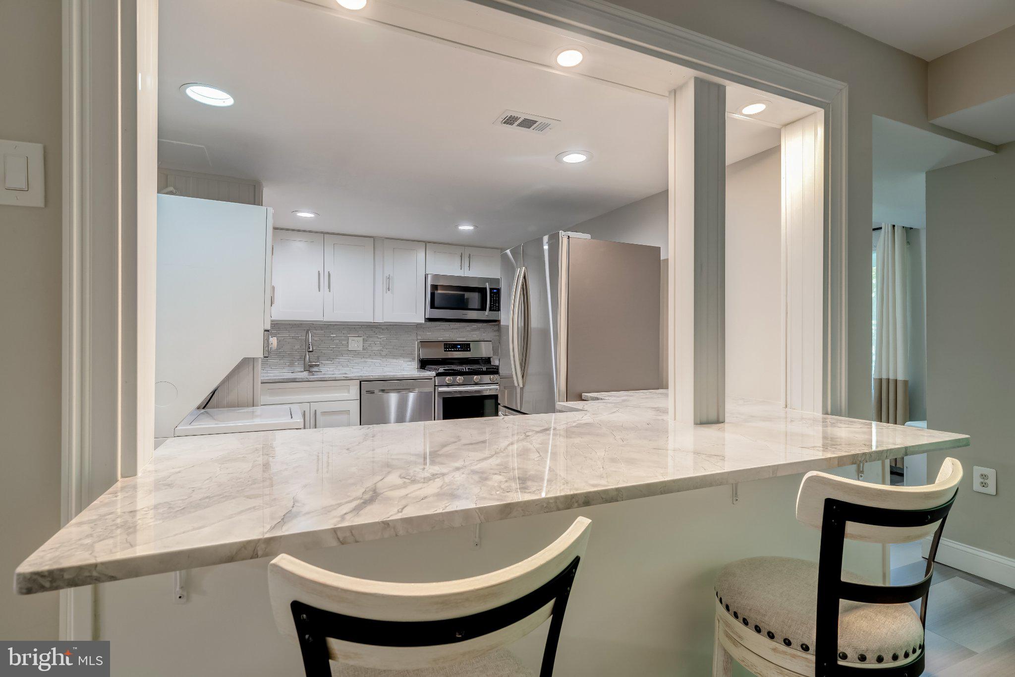 1429 Northgate Square, Unit 2A Reston, VA 20190 - Photo 11 of 25 Modern kitchen with sleek finishes.