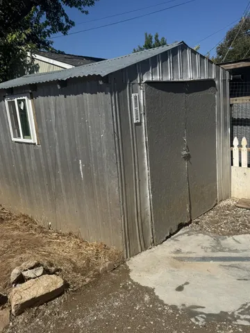 a view of a house with a wooden door