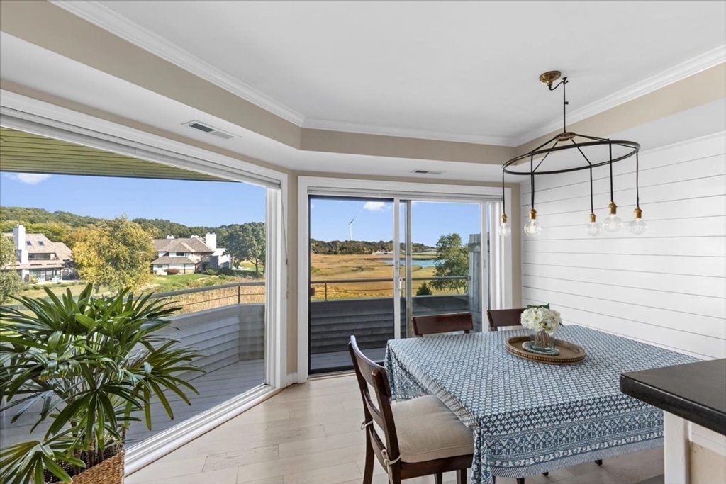 a view of a dining room with furniture window and outside view