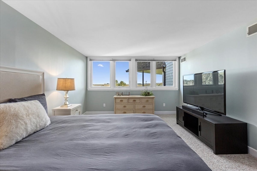 29 Ladds Way, Unit 29 Scituate, MA 02066 - Photo 12 of 33 a bedroom with a bed and a flat screen tv