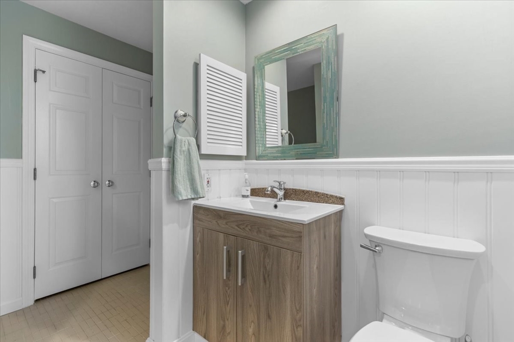 29 Ladds Way, Unit 29 Scituate, MA 02066 - Photo 14 of 33 a bathroom with a sink a toilet and a mirror