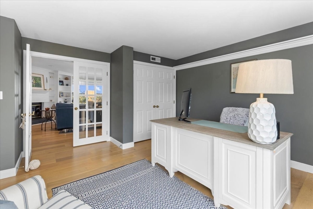 29 Ladds Way, Unit 29 Scituate, MA 02066 - Photo 17 of 33 a bedroom with a bed and wooden floor