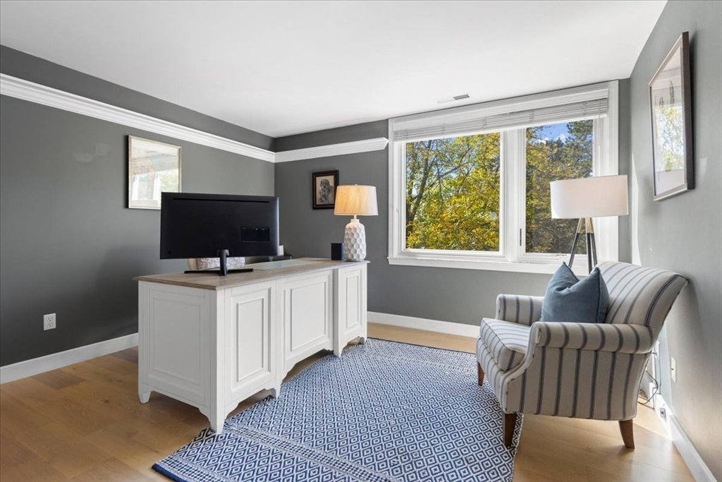 29 Ladds Way, Unit 29 Scituate, MA 02066 - Photo 18 of 33 a living room with furniture and a flat screen tv